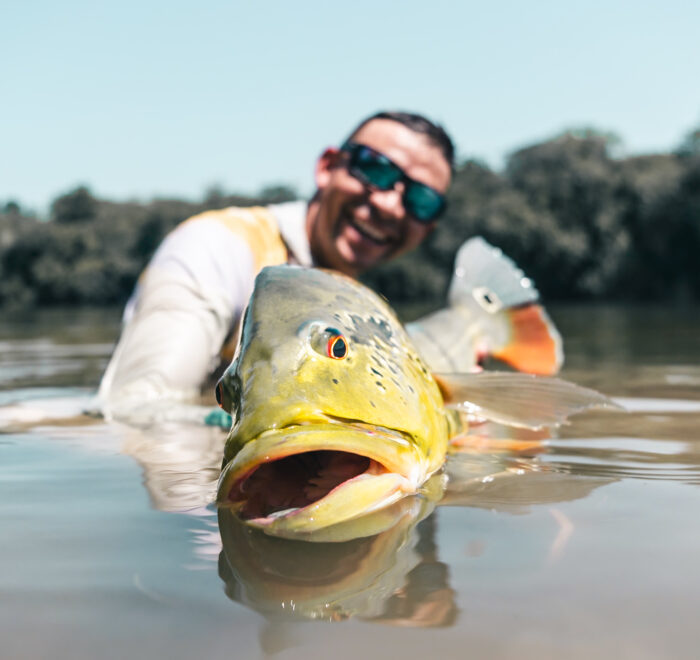 Angler fishing for Peacock Bass in an exclusive, low-pressure lagoon on the Orinoco River. Travel with Fishing ByEcolodge to explore Colombia's most pristine fishing spots.